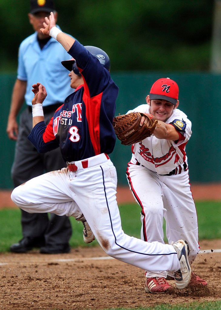Adam Pexton of Whitestown, N.Y., can't avoid the tag by Patrick Donohue of Norwalk, Conn. Whitestown advanced to the regional finals with a 9-5 victory.