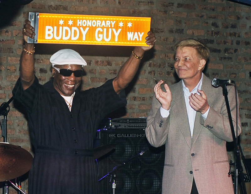 Chicago Alderman Robert Fioretti, right, applauds after reading a proclamation from Mayor Rahm Emanuel in honor of Chicago blues legend Buddy Guy, left, who was presented with a street name in his honor in Chicago on Sunday.