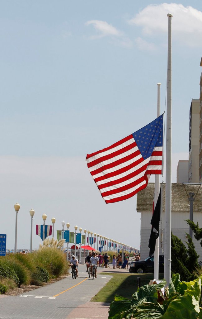 A U.S. flag flies at half-staff Monday in Virginia Beach, Va., the base of Navy SEAL Team Six, whose members were killed in a helicopter crash in Afghanistan.