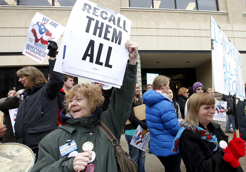 Demonstrators call for the recall of Republican state Sen. Dan Kapanke outside the Wisconsin Government Accountability Board in Madison, Wis., earlier this year.