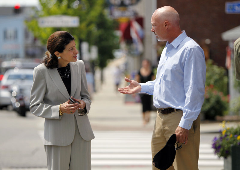 Sen. Olympia Snowe speaks with Ian Engleman of Scarborough in Saco on Tuesday. She told one restaurant owner, “I’ve never seen a worse Congress in my whole political life.”