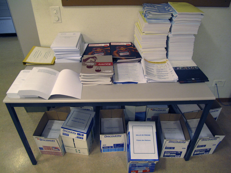 Files and documents pile up in a United Nations office at the Palais des Nations in Geneva, Switzerland. The U.N. is putting a word limit on reports because of the cost of reproducing and translating them.
