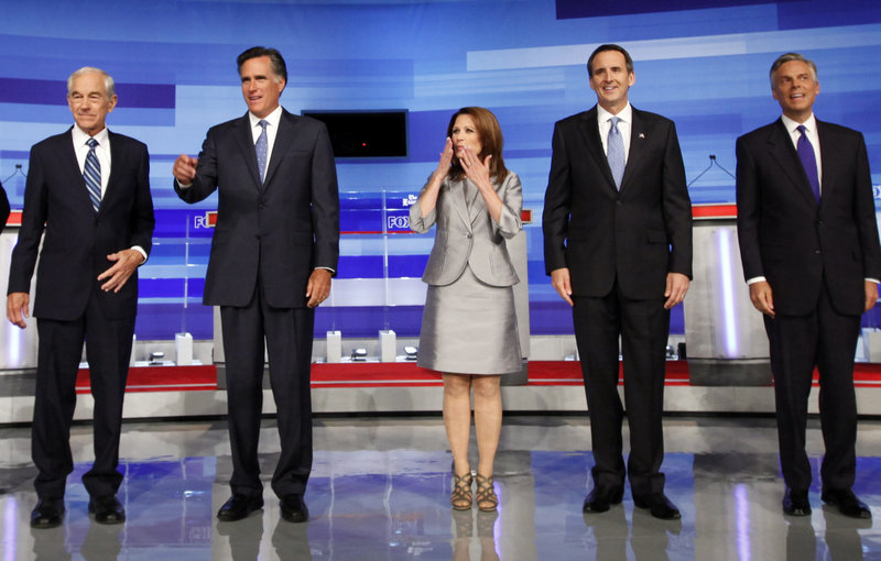 Republican presidential candidates, from left, Ron Paul; Mitt Romney, former Massachusetts governor; Michele Bachmann, U.S. representative from Minnesota; Tim Pawlenty, former Minnesota governor; and Jon Huntsman appear before the start of the GOP/Fox News Debate in Ames, Iowa, Thursday.
