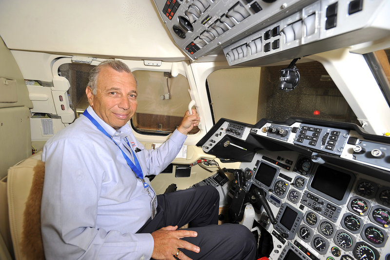 Allyn Caruso, CEO of Maine Aviation, sits in the cockpit of a Raytheon Hawker 1000, a nine-passenger jet his company has refurbished for resale.