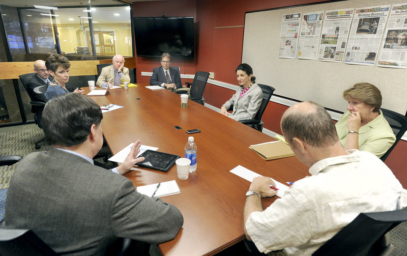 Sen. Olympia Snowe, at center right, speaks with members of the Press Herald editorial board and news staffers during an Aug. 5 visit.