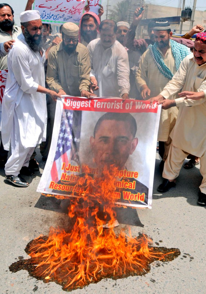 Activists of a local social group Muthahida Shehri Mahaz burn a banner depicting U.S. President Barack Obama during a rally to condemn the killing of al-Qaida leader Osama bin Laden, in Pakistan on May 8. The U.S. can’t be complacent about terror threats.