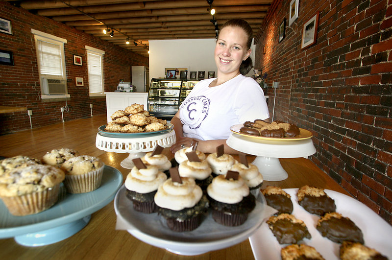 Vicki Pettinger, owner of Coastal Cakes, shows off some of the products available in her new store in Saco. She decided to rent space in Pepperell Square, just off Main Street, to help keep costs at a minimum.
