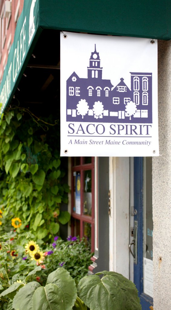A sign supporting downtown Saco hangs near the Blue Elephant Cafe on Pepperell Square, just off Main Street.