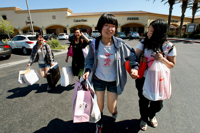 Cherry Cui, from left, Jane Zhu, Mamie Chan and Tequila Song hit Camarillo Premium Outlets in Camarillo, Calif., during their trip from Shanghai last month.