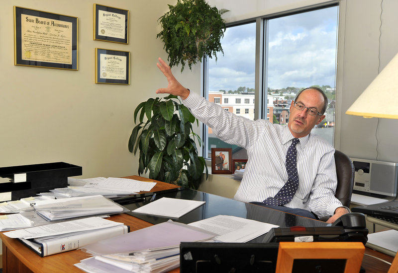 “The good news is that clients always need us, whether things are going well or not well,” says Charles Hahn, managing principal for Baker Newman Noyes, shown in his Portland office. Revenue in 2010 was $28 million.