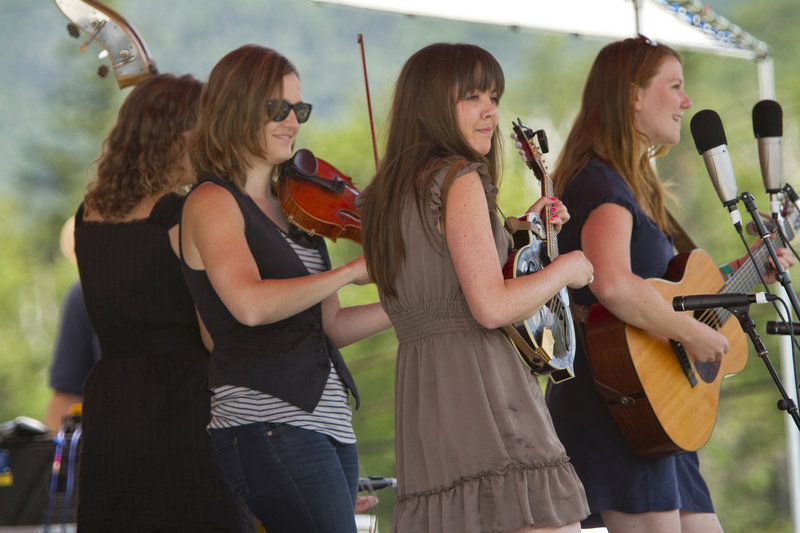 The band Della Mae plays for the crowd. They are, from left, Amanda Kowalski on bass, Kimber Ludiker on fiddle, Jenni Lyn Gardner on mandolin and Celia Woodsmith on guitar.