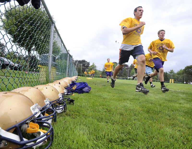 Cool, rainy weather is a football player’s best friend, as these Cheverus Stags could attest after running their laps.
