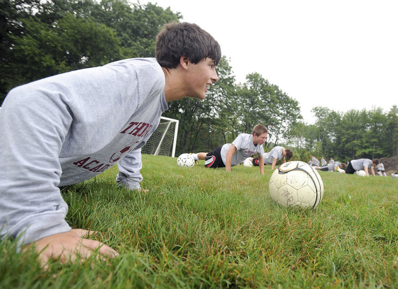 Monday's focus was conditioning, which is why Thornton Academy's Devon Vervelle was enjoying so many pushups in the wet grass in Saco.