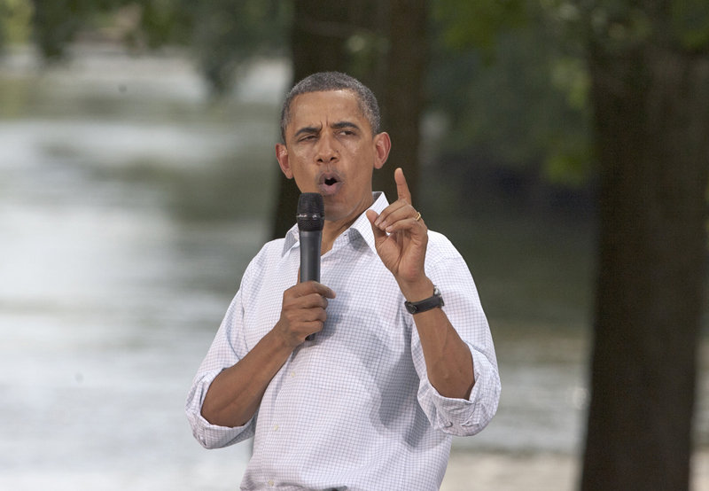 President Obama addresses a town hall event Monday in Cannon Falls, Minn., while on a three-day bus tour of the Midwest.