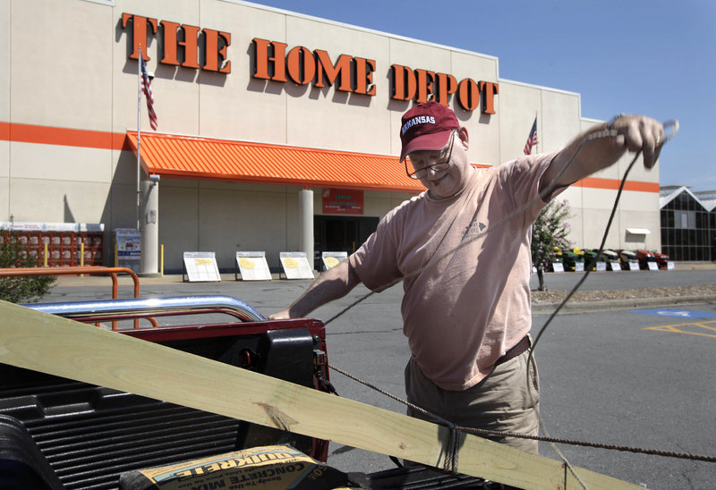 Home Depot’s second-quarter profit rose 14 percent, as shoppers picked up lawn and garden products and made storm-related repairs. Meanwhile, consumer sentiment hit a 31-year low this month.