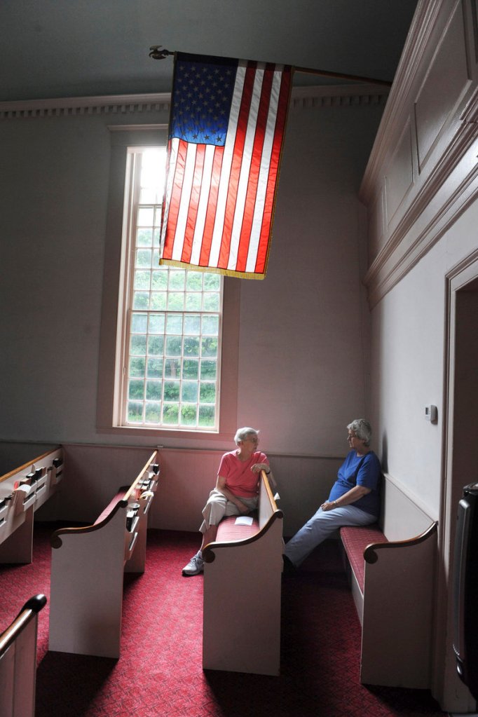 Barbara Littlefield of Kittery, left, and Linda Walton of York await the start of the 8 a.m. Sunday service inside the First Congregational Church of Kittery Point. The church was built in 1730 and is known as the oldest house of worship in Maine.