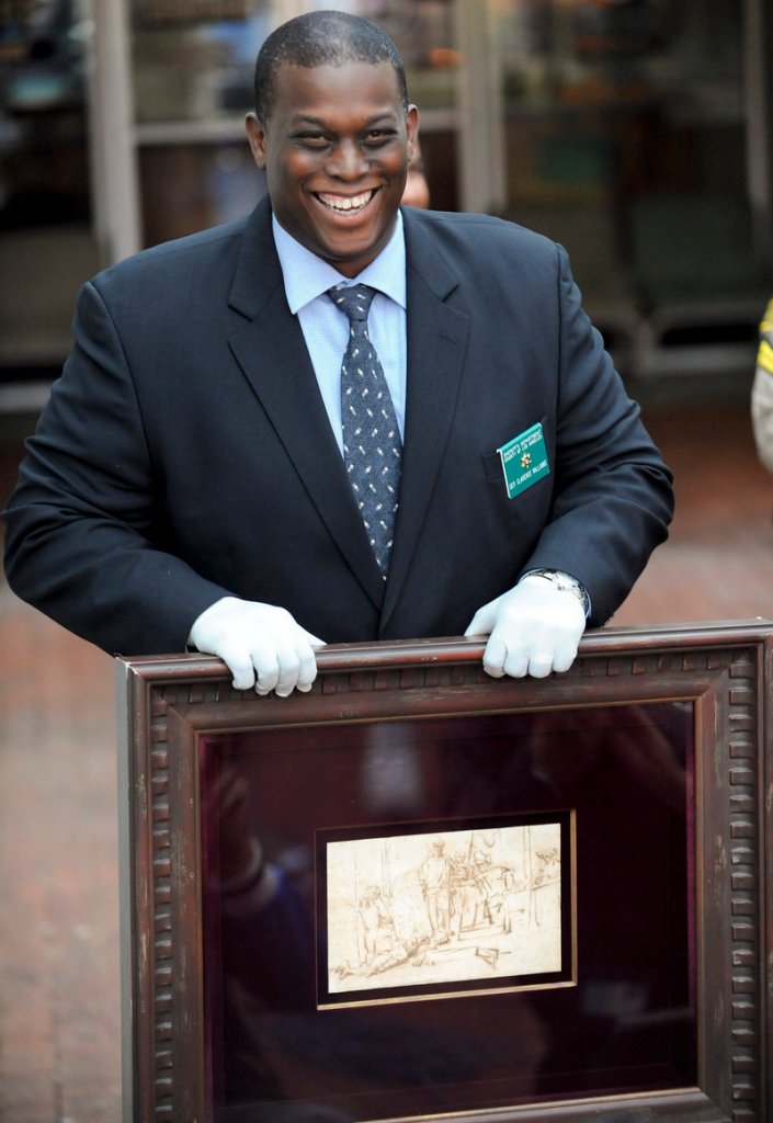 Detective Clarence Williams displays the recovered $250,000 Rembrandt pen-and-ink drawing known as “The Judgment” at a news conference Tuesday in Marina del Rey, Calif.