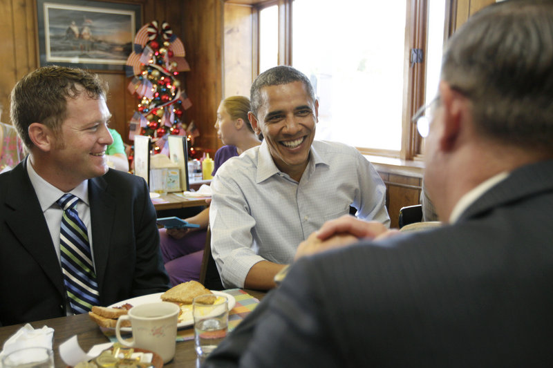 President Obama talks with small-business owners Tuesday morning at Rausch’s Cafe in Guttenberg, Iowa. “You’re what gives me strength,” he said later, praising rural residents.