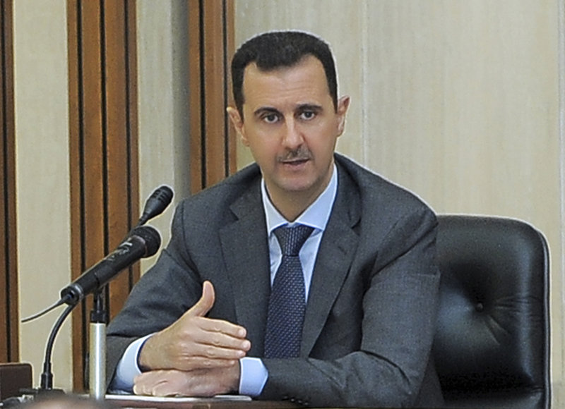 Syrian President Bashar Assad addresses a meeting for the central committee of the Baath party in Damascus on Wednesday. The resignation calls Thursday were the first explicit demands made by the U.S. and its European allies.