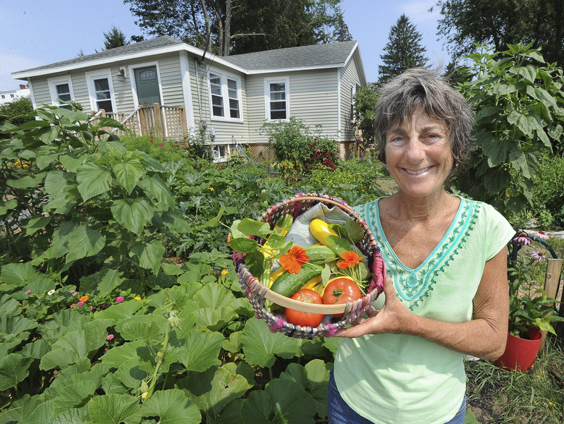 Liberty Bryer grows vegetables in a 2,000-square-foot community garden in front of her home in South Portland’s Meetinghouse Hill neighborhood. The harvest will be given to four soup kitchen sites and 42 agencies in Cumberland County.