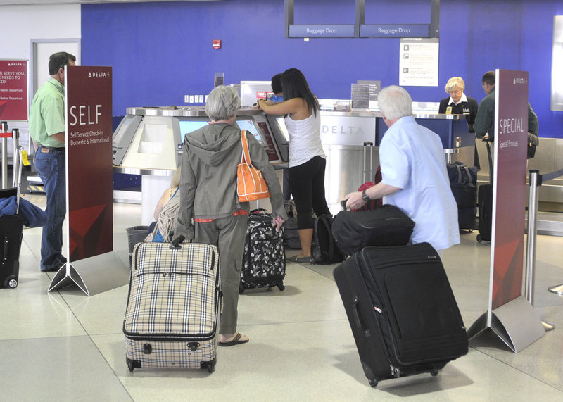 Delta passengers check in for flights in Greensboro, N.C. Delta is the largest peacetime consumer of jet fuel, edging out the Department of Defense.