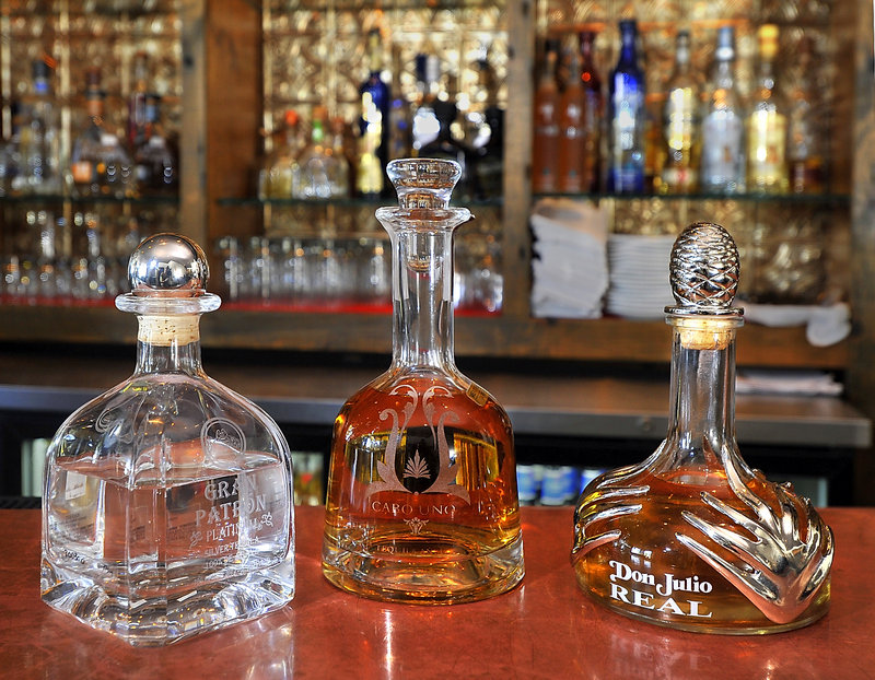 Three of the most popular higher-end tequilas offered at Zapoteca are, from left, Grand Patron Platinum, Cabo Uno and Don Julio Real.