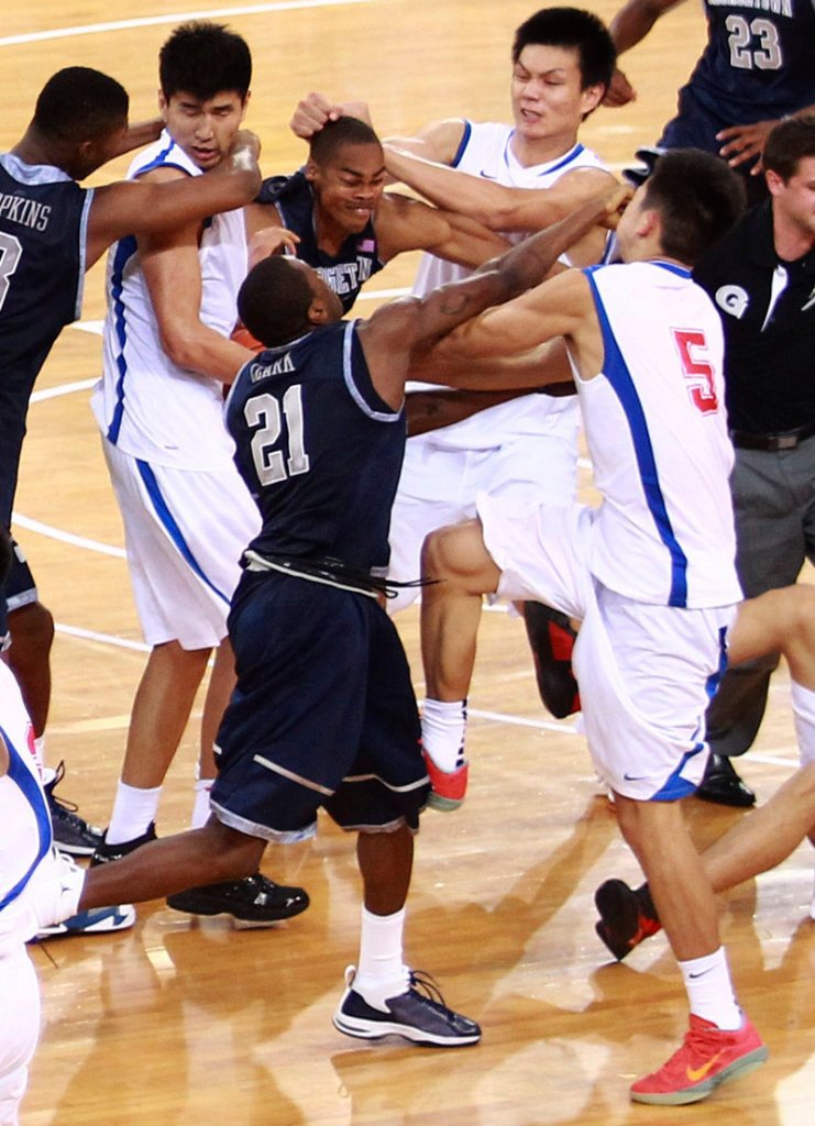 Georgetown players and members of China’s Bayi Rockets mix it up Thursday during their exhibition game in Beijing.