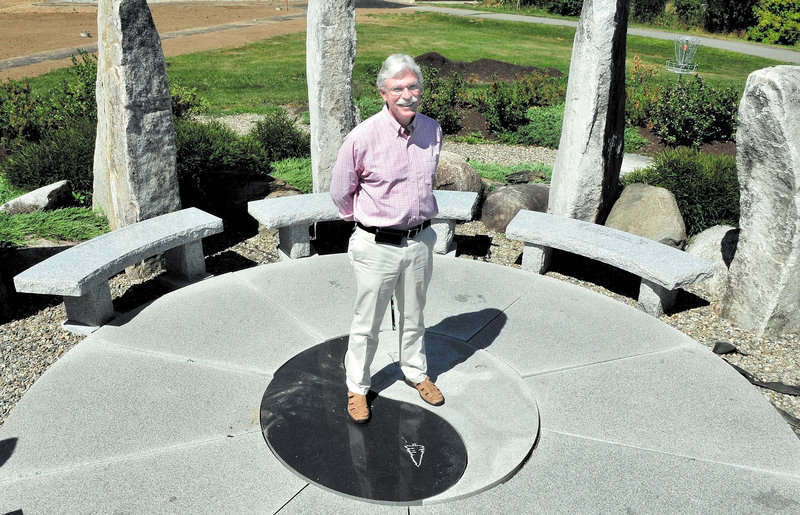 Unity College’s new president, Stephen Mulkey, stands amid a rock garden on campus. “My vision is to integrate science of sustainability into our curriculum at all levels,” he said.
