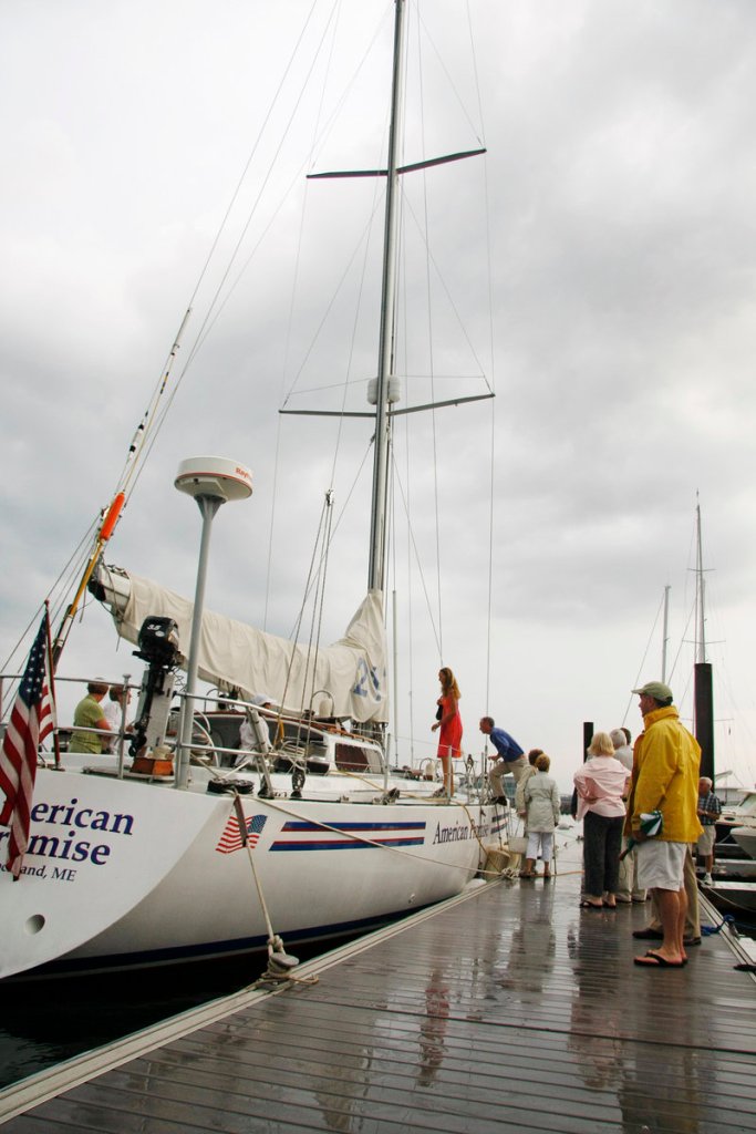 Visitors board American Promise in Portland after a tribute to Dodge Morgan on the 25th anniversary of his solo sail around the world.