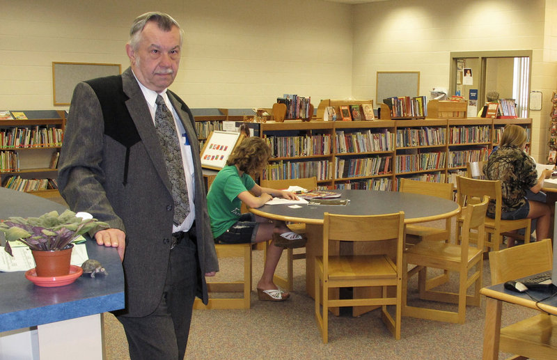 Irene-Wakonda School District Superintendent Larry Johnke stands in the high school library. The district has adopted a four-day week as state funding for schools is reduced.