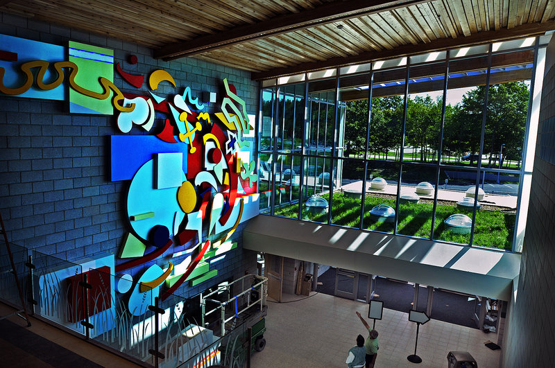 The lobby of the new Falmouth Elementary School is designed to allow light to stream into the entryway and hit the artwork on the far wall.
