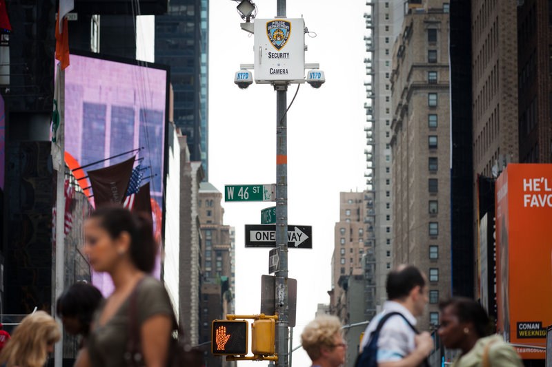 New York City pedestrians in Times Square start their morning Tuesday under the watchful eyes of surveillance cameras. The New York Police Department has become one of the country’s most aggressive domestic intelligence agencies.