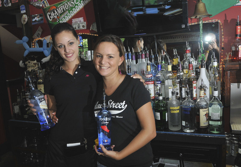 Shift leader Robin Gallant, left, and bartender Elizabeth Smith with raw materials at Maine Street Grill in Standish