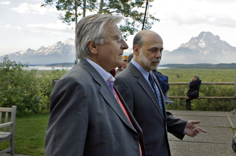 Federal Reserve Chairman Ben Bernanke, right, and Jean-Claude Trichet of France, president of the European Central Bank, take a morning stroll at Jackson Hole, Wyo., on Friday.