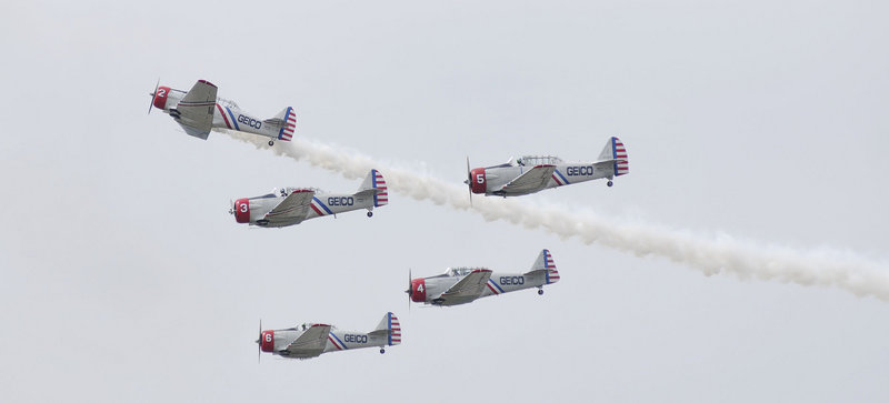 The GEICO Skytypers Air Show Team maintains a tight formation in World War II era planes during the Great State of Maine Air Show in Brunswick on Saturday. Today's show was canceled because of the weather.
