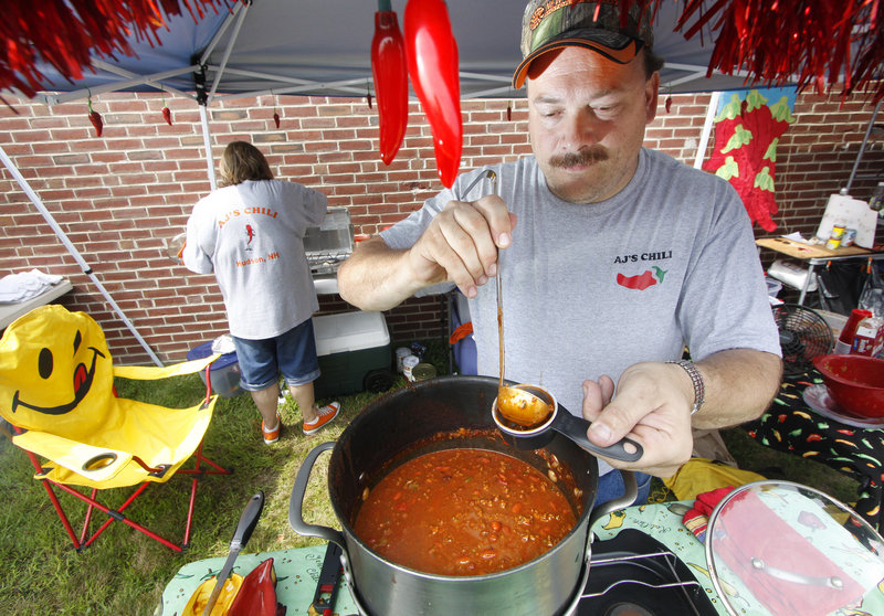 Rich Powell of AJ's Chili in Hudson, N.H., serves customers.