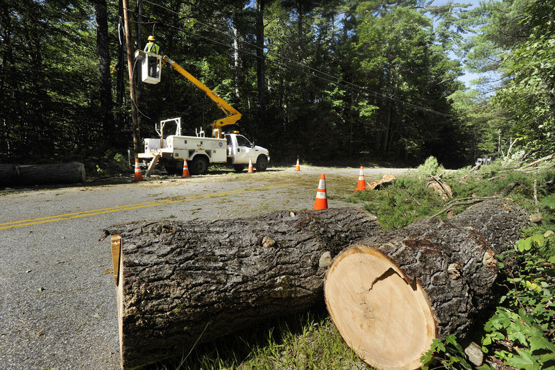 On Outlet Road in New Gloucester, a lineman for the Telephone Guys company works to restore service Monday.