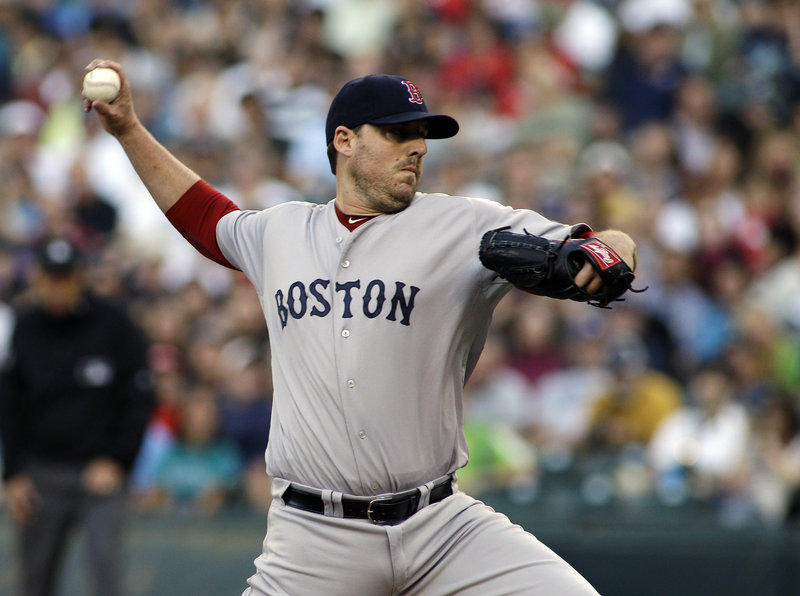 John Lackey, a key part of the pitching rotation for Boston's championship team last year, was traded to the St. Louis Cardinals on Thursday, with the Red Sox in last place in the American League East.