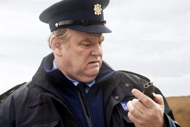 Brendan Gleeson portrays a cynical, racist veteran of the Irish state police who is teamed with a black American drug enforcement agent to solve a murder.