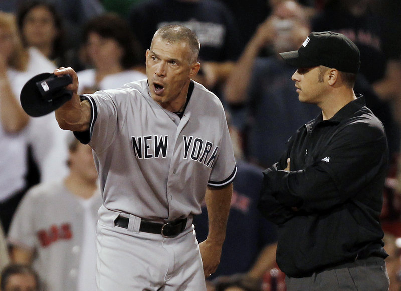 Yankees Manager Joe Girardi gets the final word in an argument with third-base umpire Mark Wegner in the ninth inning Tuesday night. They were Girardi’s final words of the game, period. He was ejected by Wegner.