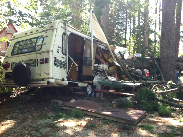 A trailer at Nason's Beach and Campground off Route 114 in Sebago was partially crushed by a tree Sunday.