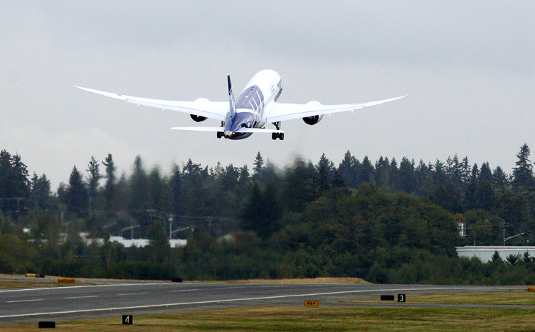 The first Boeing Co. 787 plane delivered to a commercial customer takes off for Japan today in Everett, Wash. The plane will be operated by Japan's All Nippon Airways.