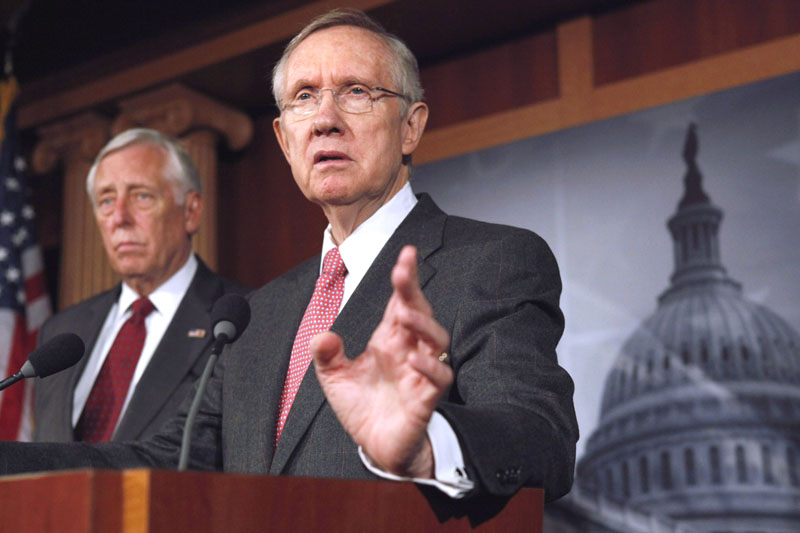 Senate Majority Leader Harry Reid of Nevada, right, accompanied by House Minority Whip Steny Hoyer of Maryland, speaks at a news conference on Capitol Hill about a continuing resolution to keep the government open.