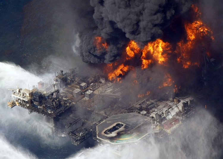 In this April 21, 2010, photo, the Deepwater Horizon oil rig is seen burning in the Gulf of Mexico more than 50 miles southeast of Venice, La.