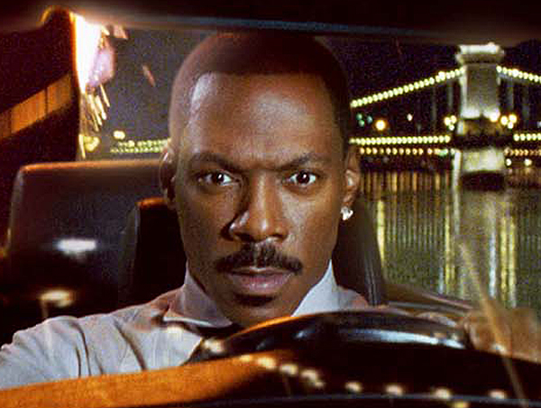 Eddie Murphy as special agent Kelly Robinson escapes on a car carrier while being pursued by villainous thugs in the action comedy "I Spy."