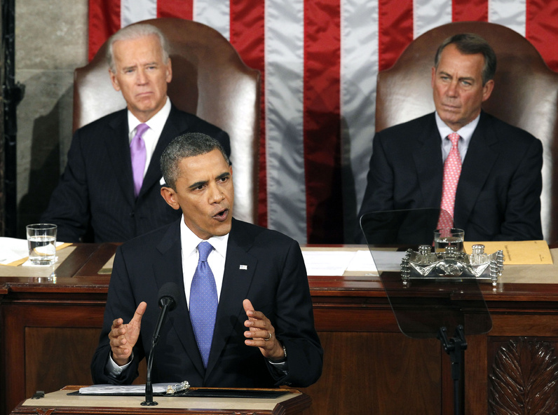 President Barack Obama speaks to a joint session of Congress Thursday. Watching are Vice President Joe Biden and House Speaker John Boehner.