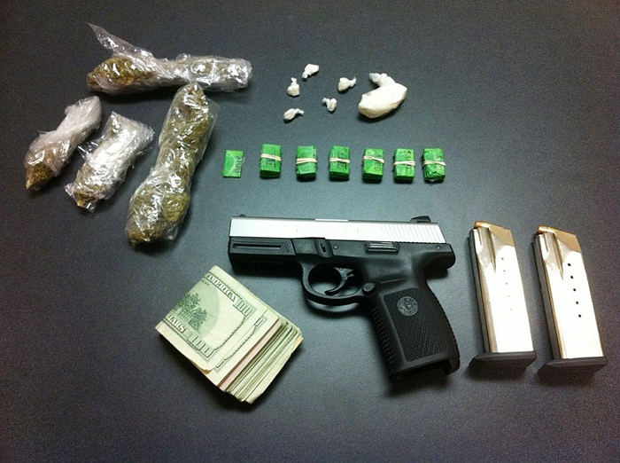 Police seized crack, heroin, marijuana, cash and a loaded .40-caliber handgun.