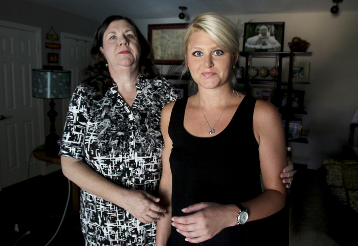 Kim Hildreth, left, and her daughter Linzy Hildreth, 25, pose for a photo at their home in Farmers Branch, Texas. Kim Hildreth conducted home drug tests on her two daughters when they were teens and now she sells the testing kits online with her daughters marketing the tests.