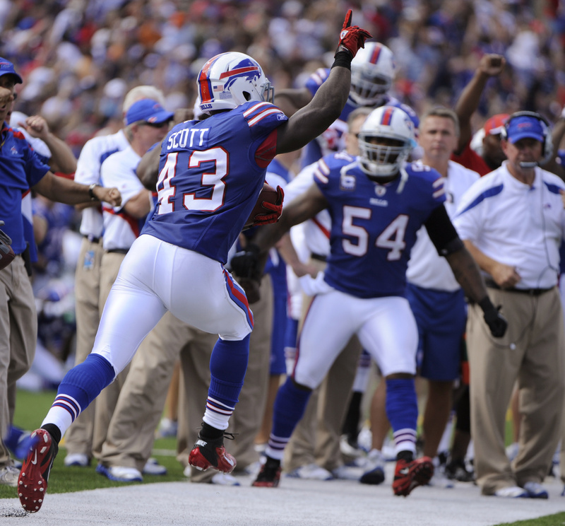 Bryan Scott, 43, of the Bills cbrates his interception against the Patriotsin today's game at Orchard Park, N.Y. The Bills rallied for a 34-31 win. NFLACTION11