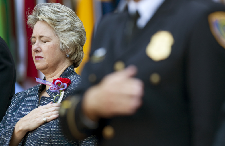 Houston Mayor Annise Parker closes her eyes during a prayer at the city's Sept. 11 Tenth Anniversary commemoration in Hermann Square Friday in Houston.